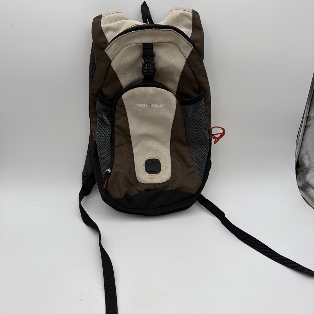 brown and beige Swiss Gear CP109 Middle Fork Hydration Backpack
